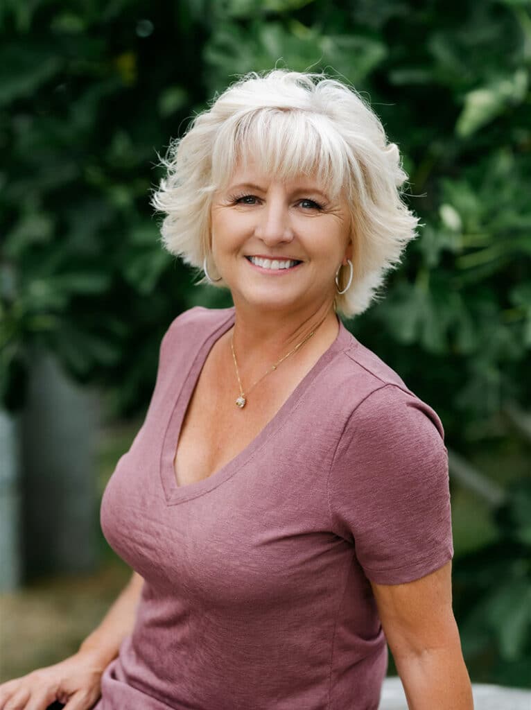 Mary Warren educational consultant and parenting coach smiling outdoors